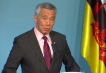李顯龍提醒民眾，即使已經接種，也應遵守保持社交距離等防疫規定。（路透社資料圖片）