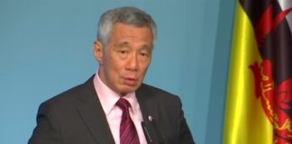 李顯龍提醒民眾，即使已經接種，也應遵守保持社交距離等防疫規定。（路透社資料圖片）